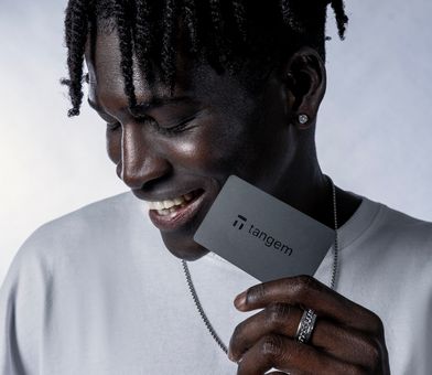 Man holding tangem wallet